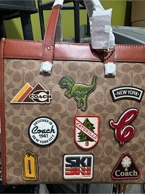 Coach Brown/Tan Signature Tote with Red Trim and Patch Accents.